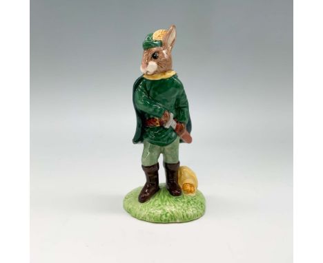 This charming figurine from the Robin Hood Collection features a Bunnykins character dressed as Robin Hood, complete with a f