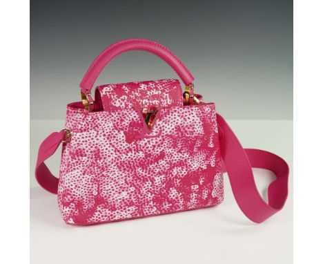 This is an authentic LOUIS VUITTON LV X YK Taurillon Infinity Net Capucines BB in Fuchsia. This classic handbag is crafted of
