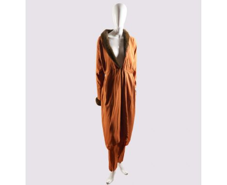 Crafted in France by Tan Giudicelli, this stunning two-piece ensemble is composed of a long, flowing robe-style jacket and ma