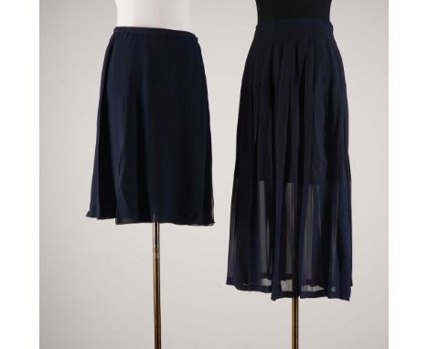 This lot features two elegant skirts from Valentino Boutique, both crafted in a flowing navy fabric. One is a knee-length A-l