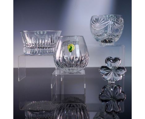 This exquisite 4-piece set by Waterford Crystal features three intricately cut bowls and a striking shamrock-shaped figurine,