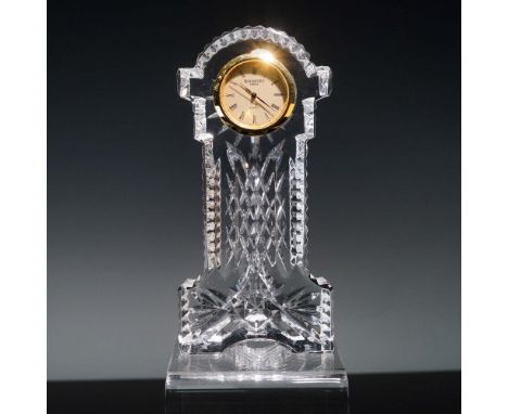 This elegant Waterford Crystal desk clock features a gracefully cut pedestal design with signature diamond and vertical criss