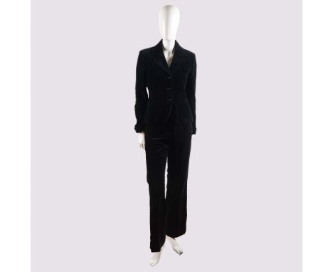 This chic ensemble features a classic black velvet jacket by Jaeger, tailored in Great Britain and designed to evoke a timele