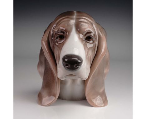 Lladro Dogs Head Figurine model 1149 is a finely crafted glazed porcelain sculpture created by Juan Huerta at the LladrÃ³ fac