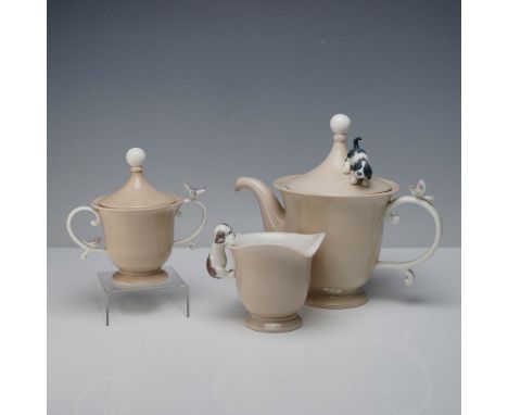 A charming three piece porcelain tea set features a lidded coffee Pot 6039, creamer 6040, and lidded sugar bowl 6041. The set