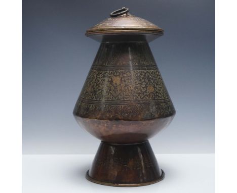 A lidded Middle Eastern copper and brass vessel featuring an elegant tapering silhouette and flared foot, decorated with fine