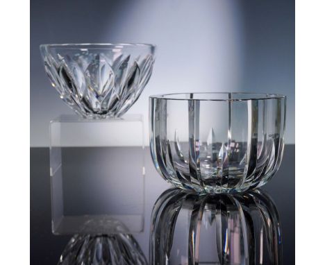 This elegant pair of crystal bowls from Swedish glassmaker Kosta Boda features striking clarity and deep vertical cuts that e