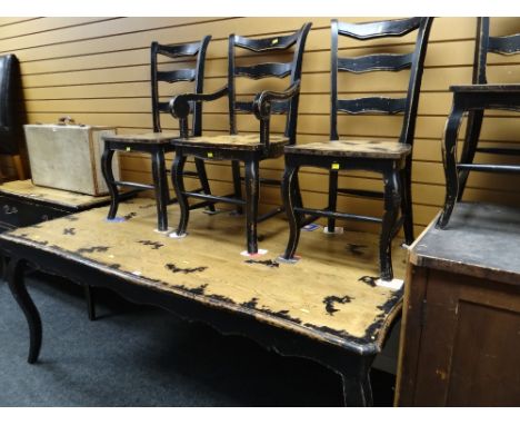A modern French country-style part painted black dining table together with six matching ladder back chairs (4+2)