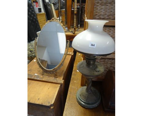 Green ceramic & brass effect based oil lamp together with a small swivel gilt metal toilet mirror