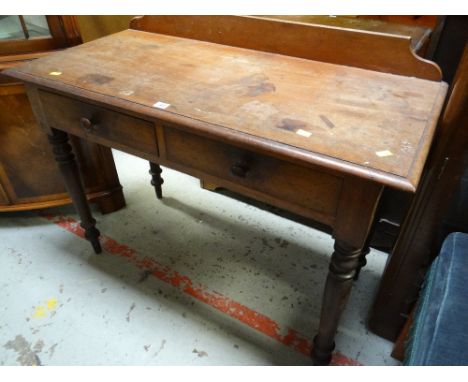 A two-drawer vintage writing desk
