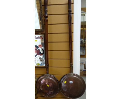 Two vintage copper bed warming pans