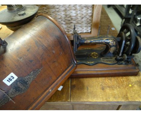 A vintage cased Singer sewing machine