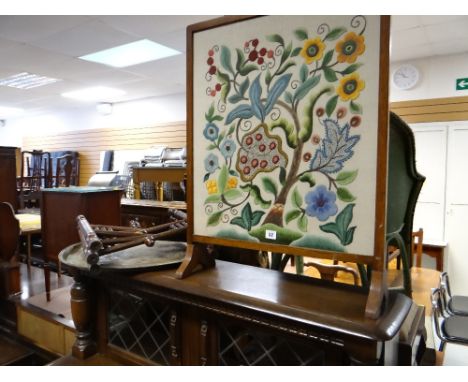 A tapestry fire screen and a Benares brass tea table with folding base
