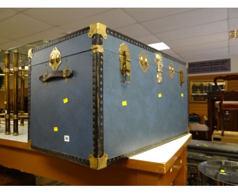 A modern brass effect and studded steamer trunk