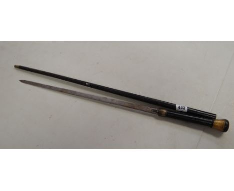 A black metal & gold decorated sword stick Condition report: It is a metal cased swordstick, the case is covered in pitting, 