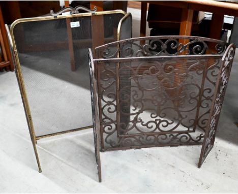 A scroll design wrought iron folding firescreen, 96 x 60 cm to/w brass and mesh panelled folding screen (2) 