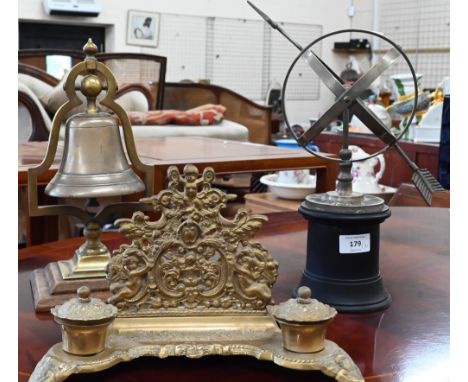 A modern brass Armillary sundial, 15 cm diameter, to/w a counter-bell on a bracket and a brass desk-stand (3) 