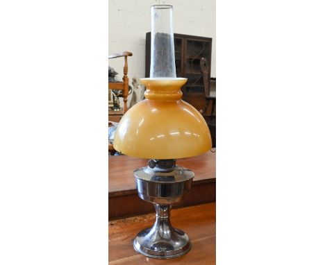 A chrome oil lamp with glass shade 