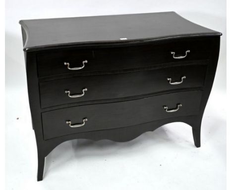 Julian Chichester, a faux smoked oak grained large serpentine commode chest of three long graduated drawers, with nickel plat