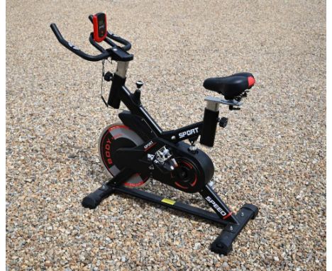 A 'Body Train' exercise bike with fly wheel (manual in office) 