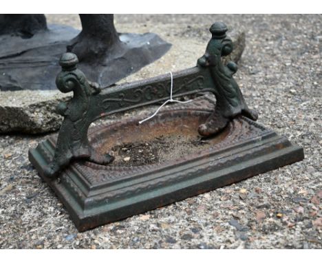 A vintage cast iron boot scraper 