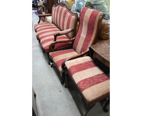 An Edwardian moulded walnut framed three seat salon sofa to/w a Victorian salon open armchair and a stool - all in the same f