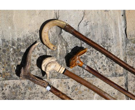 A horn and hazel shepherd's crook to/w a walking stick with antler handle and two other walking sticks (4) 