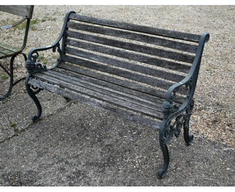 A weathered wood slat Victorian style garden bench with alloy frame, 126 cm w 