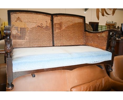 An oak framed bergere two seater sofa wtih caned decoration, 140 cm wide x 80 cm deep x 80 cm high 