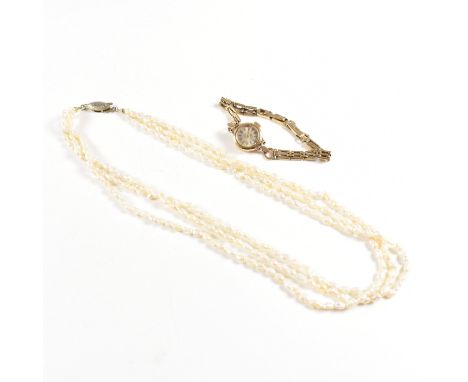 A hallmarked 9ct gold Rotary dress watch together with a rice pearl necklace with silver gilt clasp. Watch weight 12g. Neckla