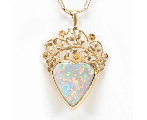An Arts and Crafts opal heart pendant necklace. The pendant attributed to the Artificers Guild Limited. The pendant set with 