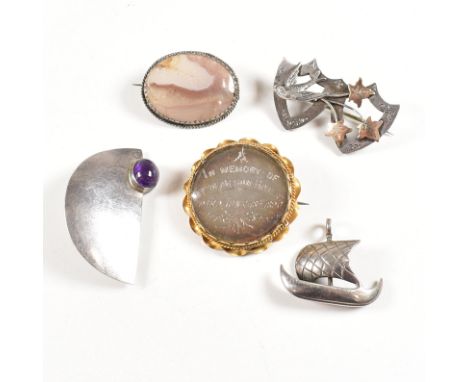 A collection of silver and white metal brooch pins and silver necklace pendant. The Brooches to include a silver sweat heart 