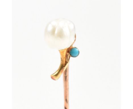 A cased 19th century gold, pearl and turquoise stick pin in the form of a flower. Stamped 9ct to pin and 15ct to head. Cased 