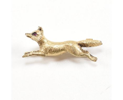 A 19th century Victorian 15ct gold and ruby fox brooch pin. The brooch in the form of a running fox with ruby cabochon eyes h