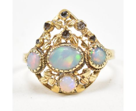 An Art Nouveau 18ct gold opal and diamond panel ring. The ring attributed to Liberty of London set with four opal cabochons. 