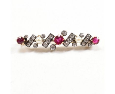 An early 20th century ruby, diamond and pearl brooch pin. Principle ruby measures 4.6mm x 4.2mm x 2.3mm. Presented in case fo
