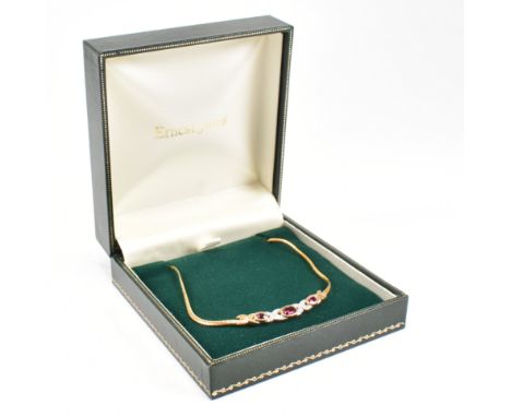 A hallmarked 9ct gold synthetic ruby and diamond pendant necklace. Weight 6.4g. Measures 43cm. Cased.&nbsp;All weights, measu
