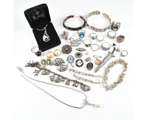 A large collection of assorted silver and white metal costume jewellery. The jewellery to include a 925 foliate bracelet with