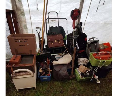 A large quantity of garden equipment, golf clubs, tools, a petrol strimmer etc.