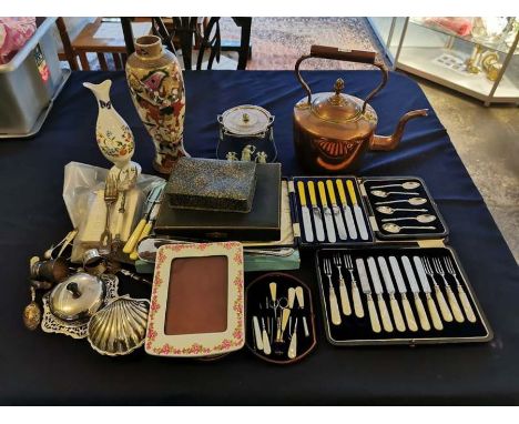 A large quantity of miscellaneous items inside a 19th century wooden bound travelling trunk, to include; silver plated items,