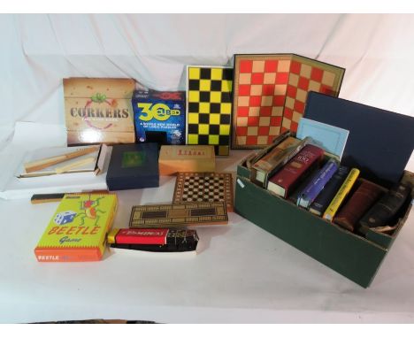 A group of books and various games to include a Staunton pattern chess set and other games
