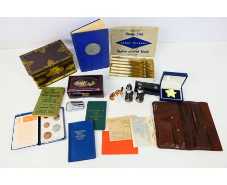 A mixed lot of collectables to include Royal Doulton kitten figure, police figures, vintage wallet, trinket box, cigarette li