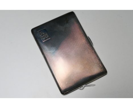 A George VI silver cigarette case with engine turned decoration and gilt interior, Birmingham assay 1946, approximately 187 g