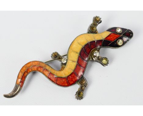 A silver brooch in the form of a gecko, the body of stone set enamel, approx 5.7 cm