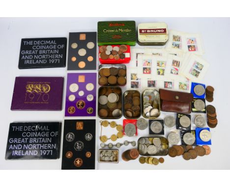 A collection of GB and foreign coins, three coin sets, 1970 and two 1971, a small quantity of stamps, a small quantity of Vic