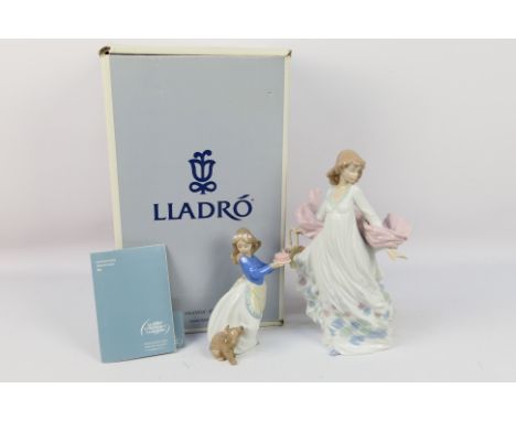 A boxed Lladro figure # 5898, Spring Splendor, depicting a young lady with a basket of flowers, approximately 30 cm (h), also
