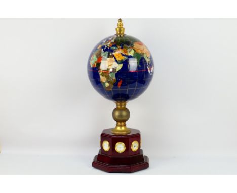A large gemstone terrestrial globe with clock and thermometer, approximately 73 cm (h) and 30 cm (d). [W]