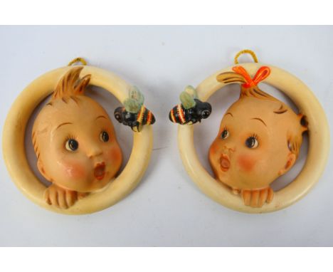 Goebel - A pair of Hummel Ba Bee wall plaques, boy and girl surprised by a bee, impressed crown mark to each, 12.5 cm (d)