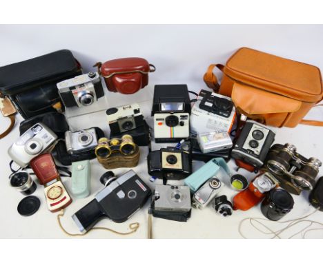 A collection of cameras and accessories to include Kodak, Pentax and other, also two pairs of opera glasses including an enam