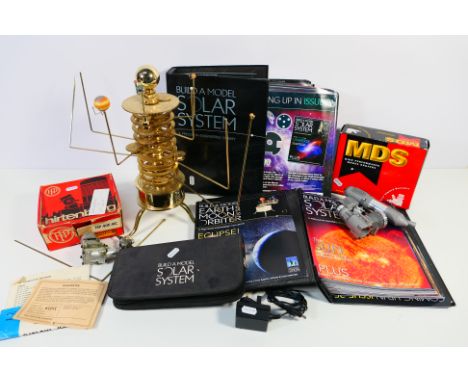 An Eaglemoss Build A Model Solar System brass orrery, magazines, tools and also two motors, unchecked for completeness. [2]. 